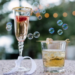 Tahoe Wedding Planners specialty drinks garnished with horseshoe stir-stick with ginger at private Incline wedding venue on Lake Tahoe, Joy of Life Events image by Elena​ Graham Photography