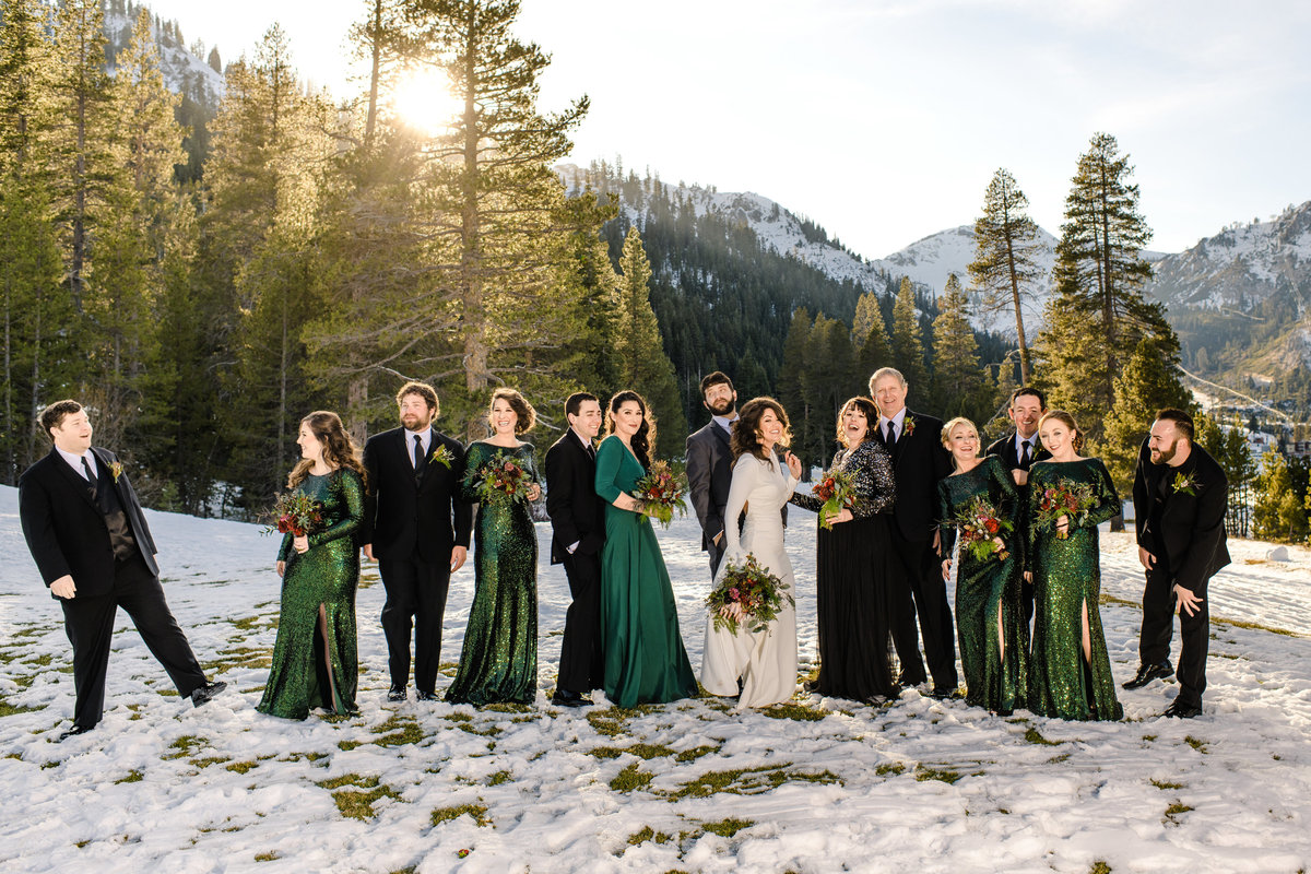 Lake Tahoe Wedding Planners bridal party in snow emerald green dresses, winter wedding at venue The Resort at Squaw Creek, Lake Tahoe, Joy of Life Events image by Charleston Churchill